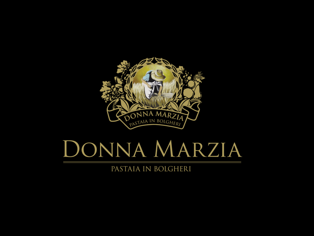 Donna Marzia logo - gold inscriptions and a circle of flowers, and in it a figure on the field wearing a hat